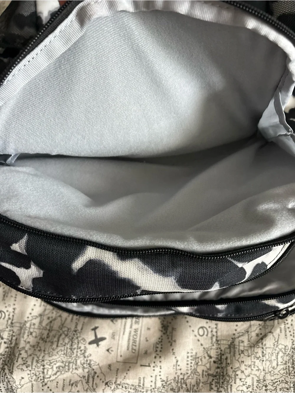 Nike Black and White Spot Pattern Backpack with Orange Swoosh